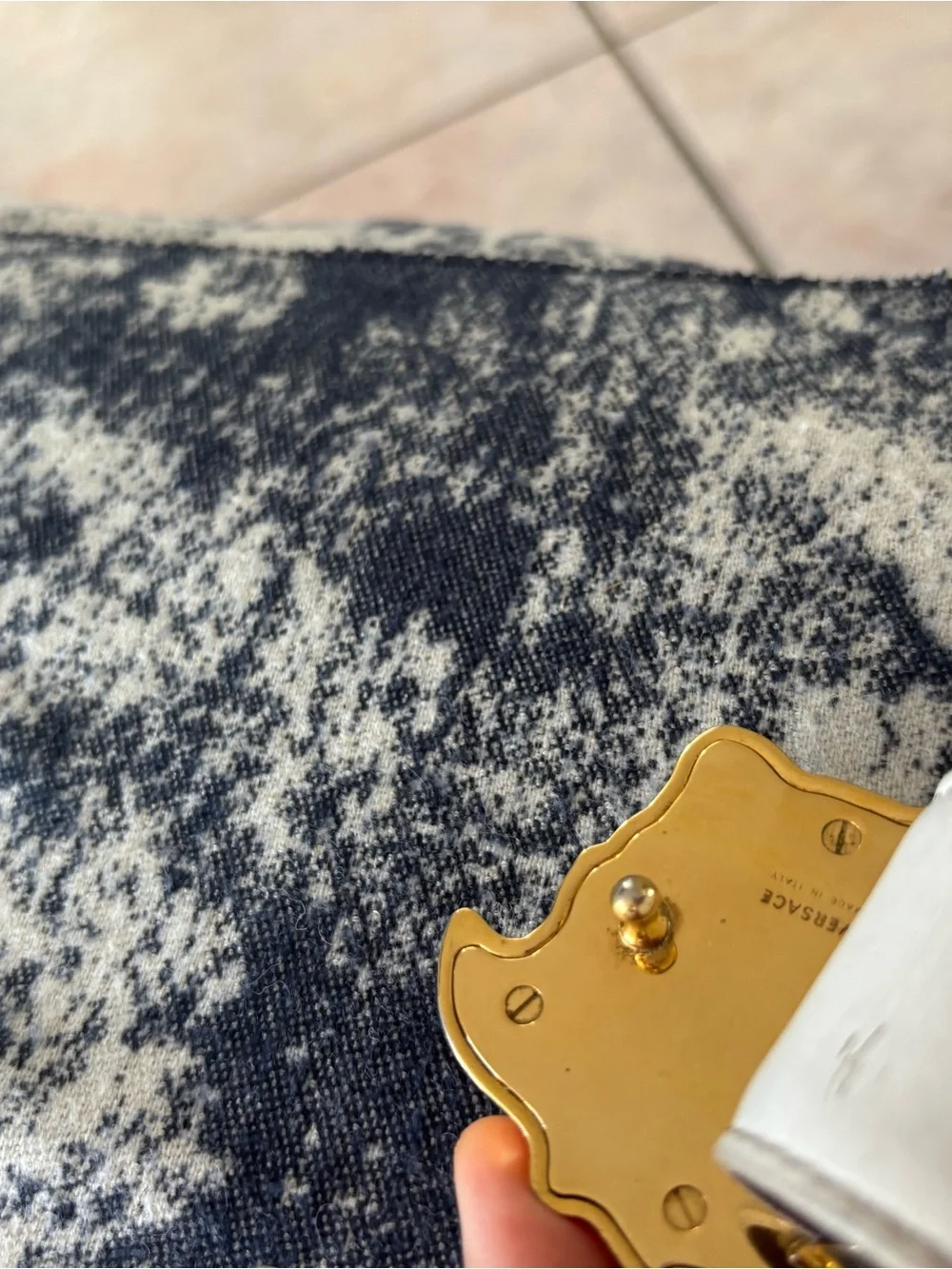 Versace down discolored